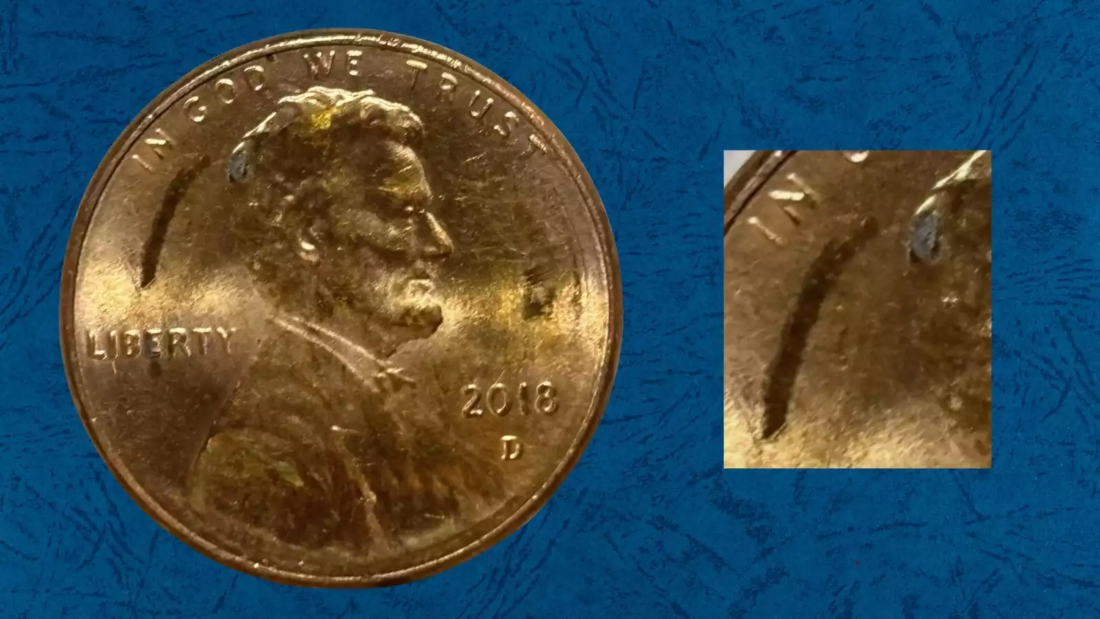 2018 penny struck-through grease error with partially obliterated design on shield reverse